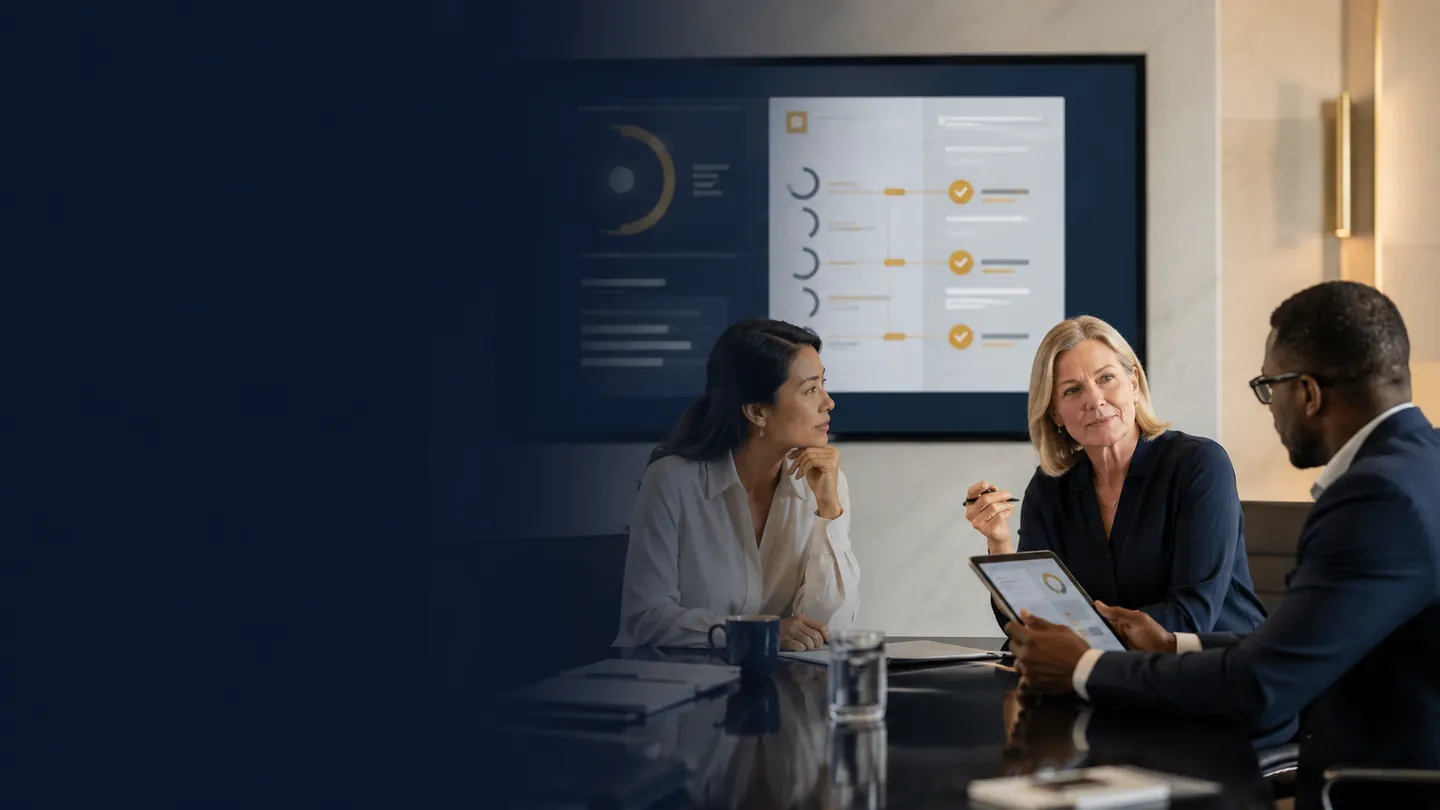 A hiring team in a meeting room reviewing candidate competency evidence on a shared screen